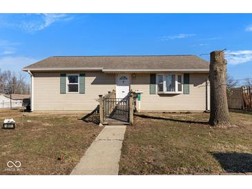 Charming one-story home with a walkway leading to the front door, offering a warm and inviting curb appeal at 817 Hamilton St, Lebanon, IN 46052