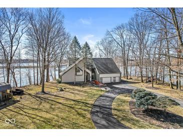 Beautiful two-story home with an attached two car garage and a winding drive at 18 Point Ln, Arcadia, IN 46030