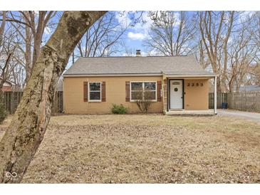 Charming single-story home featuring a cozy front porch and traditional architectural details at 2253 W Coil St, Indianapolis, IN 46260