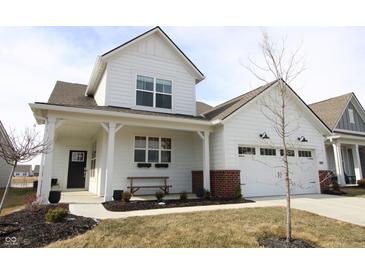 Charming two-story home with a covered porch, bench seating, and a two-car garage at 488 Ehrlich Ln, Westfield, IN 46069