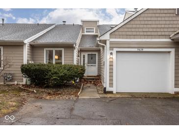 Charming condo with attached one-car garage and well-maintained landscaping at 5629 Crittenden Ave, Indianapolis, IN 46220