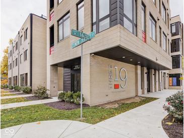 Modern building exterior showcasing brick facade and architectural details at 'The 19 The Old Northside' at 319 E 16Th St # 302, Indianapolis, IN 46202