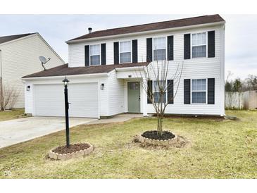 Charming two-story home with white siding, black shutters, and a well-manicured front yard at 6251 Kelsey Dr, Indianapolis, IN 46268