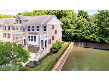 Beautiful brick townhouse with a river view and small balcony at 651 Greenford N Trl, Carmel, IN 46032