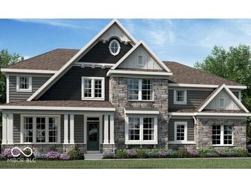 Beautiful new construction home featuring stone accents, a covered porch, and a meticulously landscaped yard at 1560 Old Hickory Ln, Westfield, IN 46074