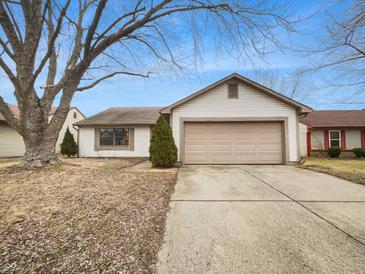 Charming single-story home with a two-car garage and a well-maintained front yard at 5721 Rosemont Ct, Indianapolis, IN 46254