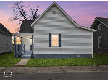 Charming exterior showcasing the home's architectural details, including the siding, roof, and covered front porch at 718 Indiana Ave, Shelbyville, IN 46176