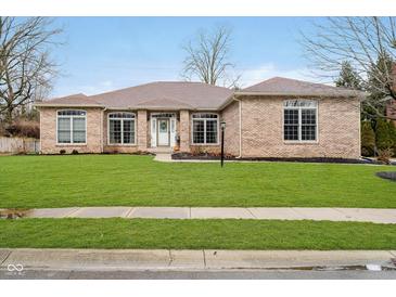 Charming brick home with manicured lawn and inviting front entrance at 6528 Hedback Dr, Indianapolis, IN 46220