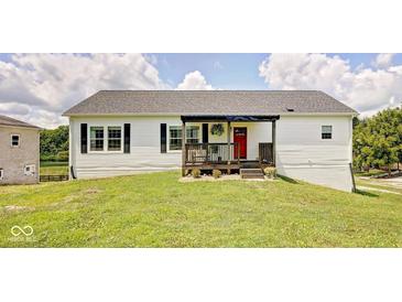 Charming single-story home with white siding, black shutters, and a bright red front door at 7859 Moore Rd, Gosport, IN 47433