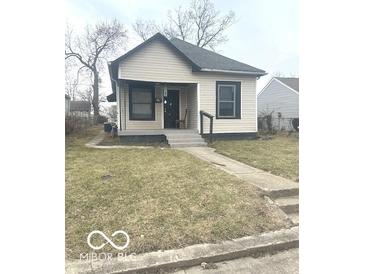 Quaint single-story house with a covered porch, awaiting your personal touches at 2526 Eastern Ave, Indianapolis, IN 46218