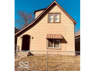 Charming two-story home featuring a quaint entrance and a classic architectural design at 2842 Indianapolis Ave, Indianapolis, IN 46208