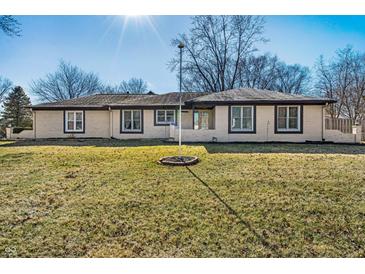 Charming, single story home with a sprawling front yard and mature trees at 5451 Buttonwood Dr, Noblesville, IN 46062