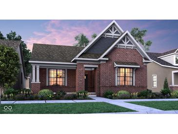 Charming brick home with a well-manicured lawn and professional landscaping at 13634 Grand Abbey Way, Fishers, IN 46037