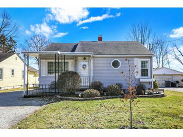 Charming one-story home with a well-manicured lawn and inviting front porch under a beautiful sky at 145 W Old South St, Bargersville, IN 46106