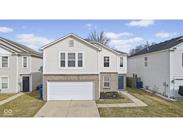 Charming two-story home featuring a two-car garage and well-maintained lawn at 11614 Presidio Dr, Indianapolis, IN 46235