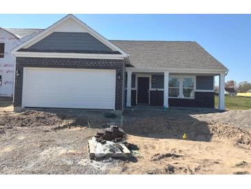 New construction featuring a brick and siding facade, an attached two-car garage and a covered front porch at 3885 Berkdale Ct, Columbus, IN 47203