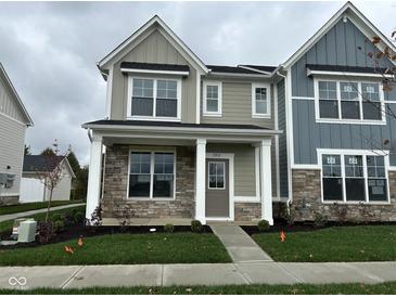 Charming two-story home with stone accents, covered porch, and manicured lawn at 3913 Wren Dr, Brownsburg, IN 46112