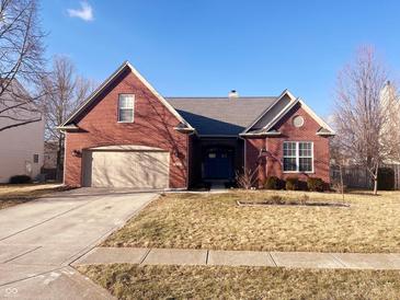 Charming single-story brick home with a well-manicured lawn and a two-car attached garage at 9978 Niagara Dr, Fishers, IN 46037