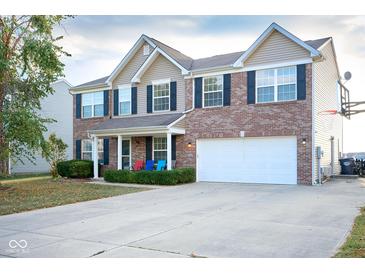 Beautiful two-story home with a brick facade, spacious driveway, two car garage, and manicured landscaping at 1288 Ivory Ct, Greenwood, IN 46143