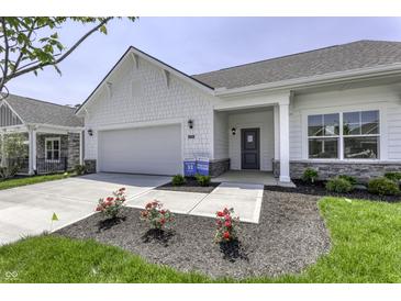 Charming single-Gathering home featuring a two-car garage, covered entry, and manicured front lawn at 16799 Imperial Ct, Fishers, IN 46040