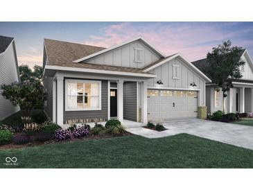 Charming single-story home with gray siding, a two-car garage, and well-maintained landscaping at 19499 Mcbee Ave, Westfield, IN 46074