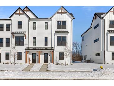 Beautiful new construction townhome with a modern farmhouse design and covered entryways at 7070 Nine Penny Dr, Brownsburg, IN 46112