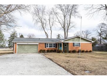 Charming brick ranch home with attached garage and well-maintained landscaping at 118 Beechwood Dr, Westfield, IN 46074