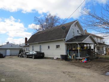 View of a two-story home with siding and an asphalt shingle roof at 169 E Washington St, Morgantown, IN 46160