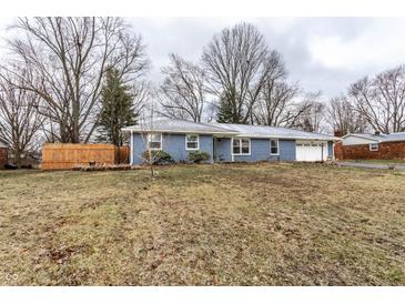 Charming single-story home featuring a well-manicured lawn and brick facade at 7671 Sherry Ln, Brownsburg, IN 46112