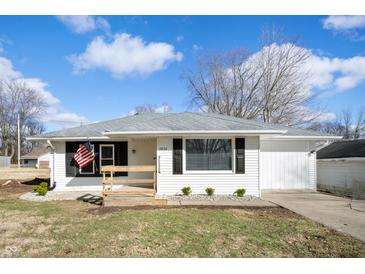 Charming ranch home with white siding, black shutters, and an inviting front porch at 3626 St. Charles St, Anderson, IN 46013