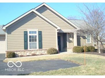 Lovely exterior of home with green shutters, landscaped yard, and a paved driveway at 515 Bridgestone Dr, Mooresville, IN 46158
