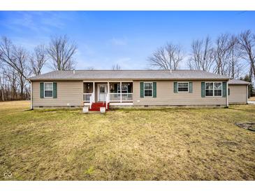 Ranch-style home featuring neutral siding, green shutters, and a welcoming front porch at 4543 E 700 N, Alexandria, IN 46001