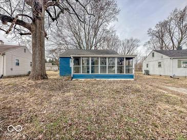 Cozy sunroom addition offers abundant natural light and complements the exterior of this charming home at 2370 N Moreland Ave, Indianapolis, IN 46222