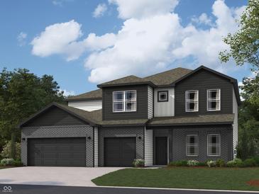 Beautiful two-story home featuring a brick facade, three-car garage, and manicured lawn at 2710 Nampa Dr, Whitestown, IN 46075