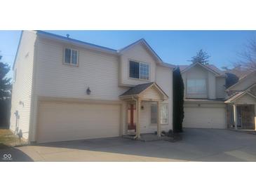 Traditional home with neutral siding, attached garage, and well-maintained front yard at 9808 Worthington Blvd, Fishers, IN 46038