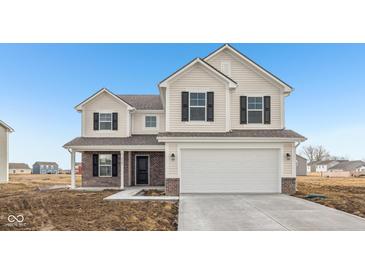 Charming two-story home featuring light siding, black shutters, and an attached two-car garage at 1585 N Regatta Dr, Greenfield, IN 46140