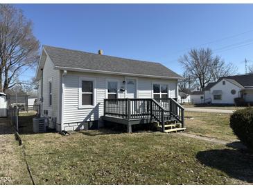 Charming single-Gathering home featuring a welcoming front porch and well-maintained lawn under a clear blue sky at 2105 N Cherry St, Columbus, IN 47201