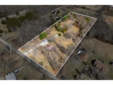 Expansive aerial view shows home with a large lot surrounded by mature trees at 2305 Bill Smith Rd, Martinsville, IN 46151