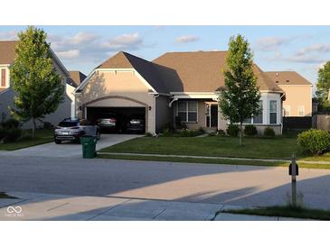Charming single-story home with brick accents, attached garage, and well-manicured lawn and landscape at 2625 Kilgobbin Cres, Brownsburg, IN 46112