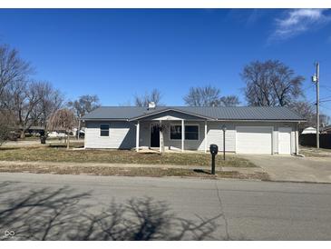 Charming single-story home featuring new metal roof and attached garage in a quiet neighborhood at 504 Iroquois Dr, Anderson, IN 46012