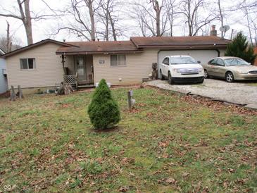 Charming single-story home featuring a two-car garage and a quaint front yard at 8 Lake Hart, Mooresville, IN 46158