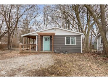 Charming single-story home featuring a covered porch and a freshly painted exterior, perfect for curb appeal at 4629 Indianola Ave, Indianapolis, IN 46205