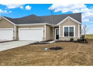 Charming single Gathering house featuring an attached garage and a well-maintained lawn at 1609 Clover Crossing Dr, Greenfield, IN 46140
