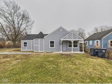 Charming single-story home with gray siding, a covered porch, and a well-maintained lawn at 3918 Columbus Ave, Anderson, IN 46013