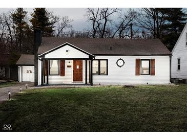 Charming renovated single-story home with inviting front door and manicured lawn at 536 W 52Nd St, Indianapolis, IN 46208