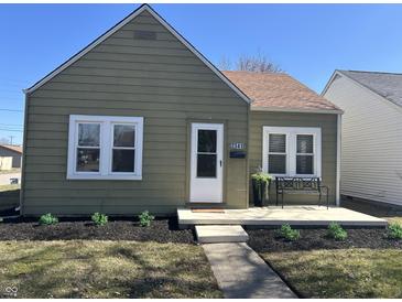 Charming home features meticulous landscaping, covered porch, and a well-maintained exterior at 2341 California St, Columbus, IN 47201