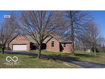 Charming one-story brick home with a well-manicured lawn and an attached two-car garage at 2731 Trailridge Ct, Martinsville, IN 46151