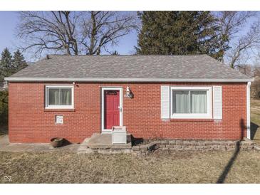 Charming single-story home with a bright red door and classic brick exterior at 3044 S Keystone Ave, Indianapolis, IN 46237