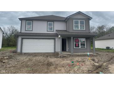 New two-story home with gray siding, a two-car garage, and classic architectural details at 3328 Stafford St, Sheridan, IN 46069
