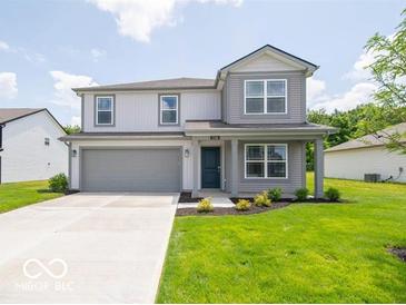 Charming two-story home with gray siding, a well-manicured lawn, and an attached two-car garage at 3328 Stafford St, Sheridan, IN 46069